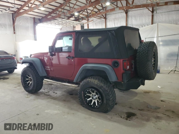 2012 Jeep Wrangler Sport with VIN 1C4AJWAG5CL233049, listed as a Copart auction lot 52328865 with 185,388 mi miles and Salvage title. Bid and sale history available at DreamBid. Image 2.