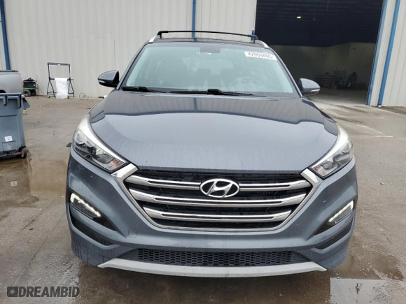 2017 Hyundai Tucson Value with VIN KM8J33A22HU367754, listed as a Copart auction lot 42009495 with 55,477 mi miles and Salvage Title. Bid and sale history available at carsss.com. Image 5.