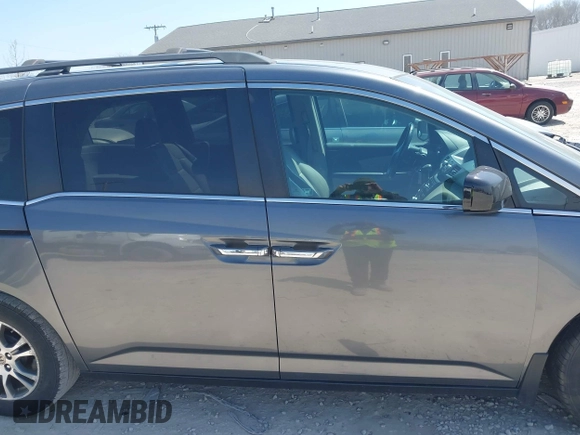 2012 Honda Odyssey EX-L with VIN 5FNRL5H69CB047425, listed as a IAAI auction lot 42064979 with 242,409 mi miles and . Bid and sale history available at carsss.com. Image 14.