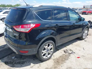2015 Ford Escape Titanium with VIN 1FMCU0JX3FUB39808, listed as a IAAI auction lot 42212271 with 136,488 mi miles and . Bid and sale history available at DreamBid. Image 4.