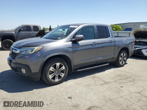 2019 Honda Ridgeline RTL-T with VIN 5FPYK2F68KB003907, listed as a Copart auction lot 61276325 with 59,612 mi miles and Salvage title. Bid and sale history available at DreamBid. Image 1.