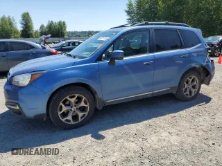 2017 Subaru Forester Touring with VIN JF2SJAWC2HH429099, listed as a Copart auction lot 64671135 with 104,709 mi miles and Salvage title. Bid and sale history available at DreamBid. Image 1.