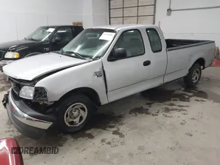 2002 Ford F-150 XL with VIN 1FTRX17W52NB23883, listed as a IAAI auction lot 41721680 with 144,115 mi miles. Bid and sale history available at carsss.com. Image 17.