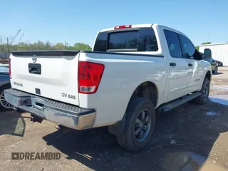 2014 Nissan Titan S with VIN 1N6AA0EC3EN502951, listed as a IAAI auction lot 41956309 with 128,464 mi miles and . Bid and sale history available at DreamBid. Image 4.