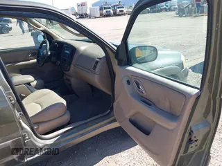 2002 Mazda Tribute LX with VIN 4F2CU08152KM02067, listed as a IAAI auction lot 42198970 with 212,613 mi miles and . Bid and sale history available at carsss.com. Image 5.
