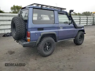1995 Toyota Land Cruiser z VIN RJ700008084, wystawiony jako Copart lot #42412845 z przebiegiem 115 152 mil mil oraz Szkoda całkowita • Salvage title. Historia ofert i sprzedaży dostępna na DreamBid. Obrazek 3.