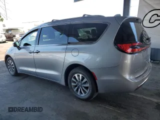 2021 Chrysler Pacifica Hybrid Touring L with VIN 2C4RC1L7XMR593911, listed as a Copart auction lot 57842415 with 74,910 mi miles and Salvage title. Bid and sale history available at DreamBid. Image 2.