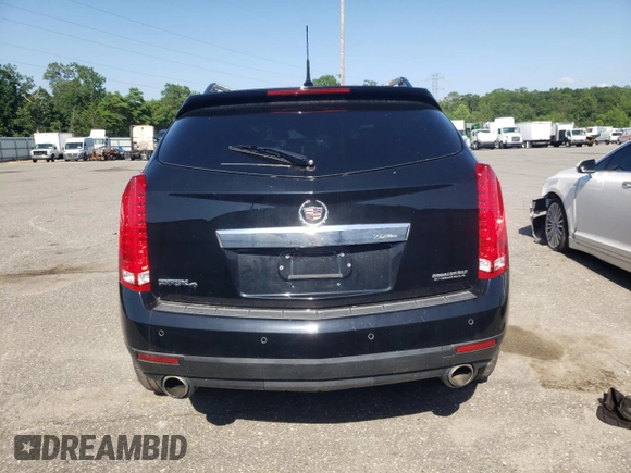 2011 Cadillac SRX Premium Collection with VIN 3GYFNFEYXBS547540, listed as a Copart auction lot 62563895 with 107,136 mi miles and Salvage title. Bid and sale history available at DreamBid. Image 6.