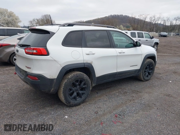 2016 Jeep Cherokee Trailhawk with VIN 1C4PJMBS7GW241076, listed as a IAAI auction lot 42020124 with 151,742 mi miles and . Bid and sale history available at DreamBid. Image 4.