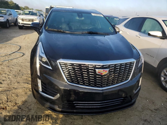 2022 Cadillac XT5 FWD Luxury z VIN 1GYKNAR49NZ159814, wystawiony jako Copart lot #74506584 z przebiegiem 7 069 mil mil oraz Nie do naprawy • Non repairable. Historia ofert i sprzedaży dostępna na DreamBid. Obrazek 5.