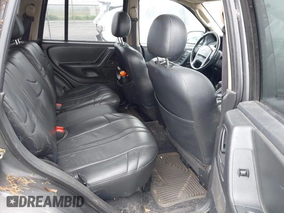 2002 Jeep Grand Cherokee with VIN 1J4GW38N62C190851, listed as a IAAI auction lot 42519384 with 142,066 mi miles and . Bid and sale history available at DreamBid. Image 8.