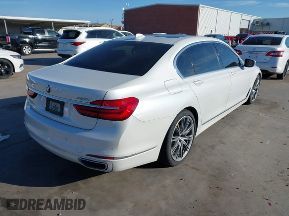 2018 BMW 7 Series 750i with VIN WBA7F0C57JGM23667, listed as a IAAI auction lot 41581035 with 113,140 mi miles and . Bid and sale history available at DreamBid. Image 4.