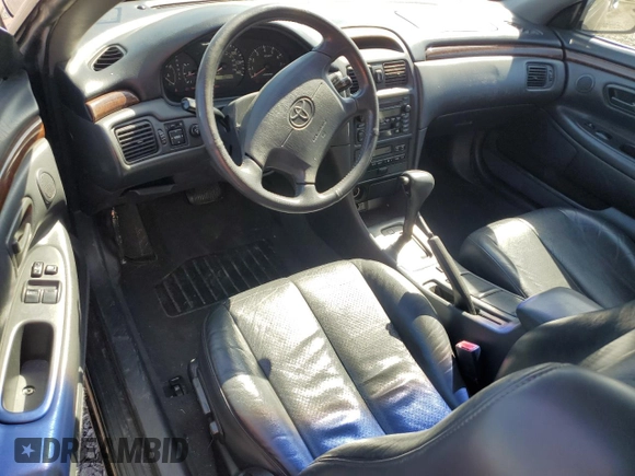 2000 Toyota Solara SE z VIN 2T1CF28P8YC296590, wystawiony jako Copart lot #49839935 z przebiegiem 192 140 mil mil oraz Czysty tytuł • Clean title. Historia ofert i sprzedaży dostępna na DreamBid. Obrazek 8.