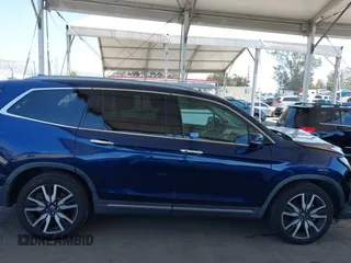 2019 Honda Pilot Touring 8-Passenger z VIN 5FNYF5H97KB013530, wystawiony jako IAAI lot #42403449 z przebiegiem 90 557 mil mil oraz . Historia ofert i sprzedaży dostępna na DreamBid. Obrazek 13.