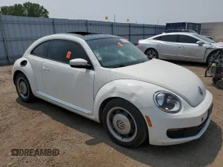 2013 Volkswagen Beetle with VIN 3VWHX7AT2DM656457, listed as a Copart auction lot 63814944 with 92,966 mi miles and Salvage Title. Bid and sale history available at DreamBid. Image 4.