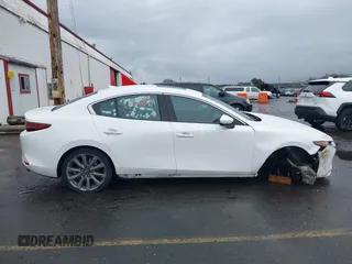2020 Mazda 3 Premium with VIN 3MZBPBEMXLM133357, listed as a IAAI auction lot 41540234 with 81,280 mi miles and . Bid and sale history available at DreamBid. Image 14.