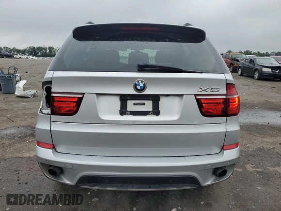 2012 BMW X5 35i with VIN 5UXZV4C57CL747717, listed as a Copart auction lot 63003135 with 135,999 mi miles and Clean title. Bid and sale history available at DreamBid. Image 6.