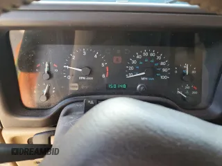 2000 Jeep Wrangler Sahara with VIN 1J4FA59S0YP795198, listed as a Copart auction lot 87920205 with 150,148 mi miles and Salvage Title. Bid and sale history available at carsss.com. Image 9.