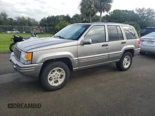 1998 Jeep Grand Cherokee Limited with VIN 1J4GZ78S2WC222768, listed as a Copart auction lot 73942154 with 0 mi miles and Salvage Title. Bid and sale history available at carsss.com. Image 1.