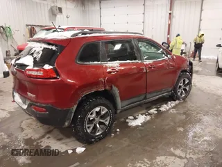 2015 Jeep Cherokee Trailhawk with VIN 1C4PJMBS2FW609999, listed as a IAAI auction lot 41582536 with 133,666 mi miles. Bid and sale history available at carsss.com. Image 4.