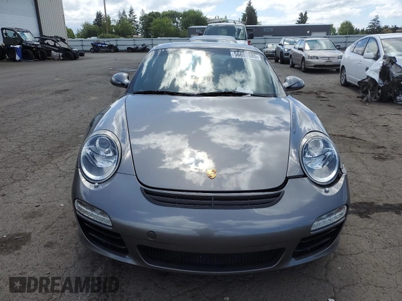2009 Porsche 911 Carrera S z VIN WP0AB29929S720512, wystawiony jako Copart lot #56697685 z przebiegiem 36 676 mil mil oraz Szkoda całkowita • Salvage title. Historia ofert i sprzedaży dostępna na DreamBid. Obrazek 5.