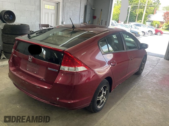 2010 Honda Insight LX with VIN JHMZE2H59AS032860, listed as a Copart auction lot 60861945 with 253,444 mi miles and Clean title. Bid and sale history available at DreamBid. Image 4.