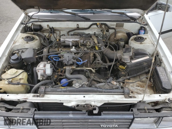 1984 Toyota Camry z VIN JT2SV16E3E0220882, wystawiony jako Copart lot #53514345 z przebiegiem 112 430 mil mil oraz Czysty tytuł • Clean title. Historia ofert i sprzedaży dostępna na DreamBid. Obrazek 11.