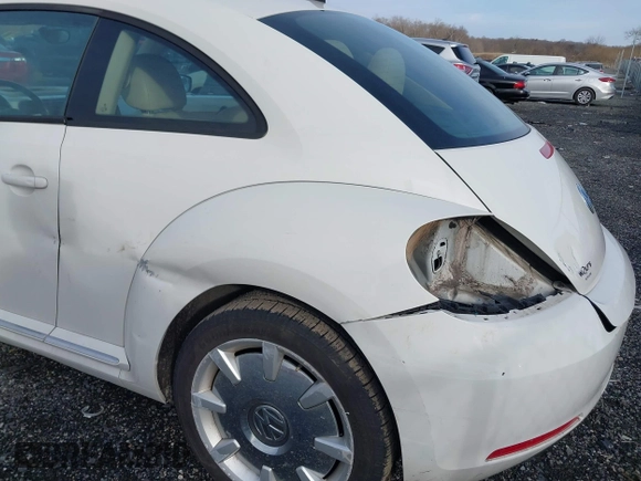 2014 Volkswagen Beetle 2.5L w/Sun with VIN 3VWJP7AT8EM611560, listed as a IAAI auction lot 41488488 with 140,798 mi miles and . Bid and sale history available at DreamBid. Image 6.
