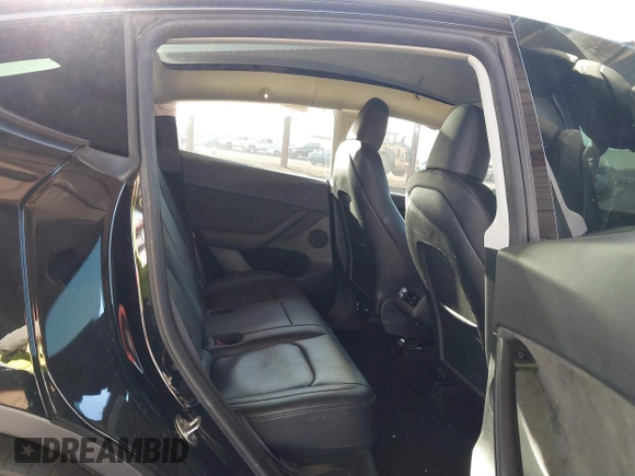 2023 Tesla Model Y Long Range with VIN 7SAYGDEE8PF815622, listed as a IAAI auction lot 41515433 with 70,862 mi miles and . Bid and sale history available at DreamBid. Image 8.