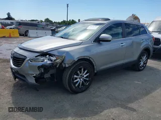 2014 Mazda CX-9 Grand Touring z VIN JM3TB2DVXE0432991, wystawiony jako IAAI lot #42826784 z przebiegiem 134 265 mil mil oraz . Historia ofert i sprzedaży dostępna na DreamBid. Obrazek 2.