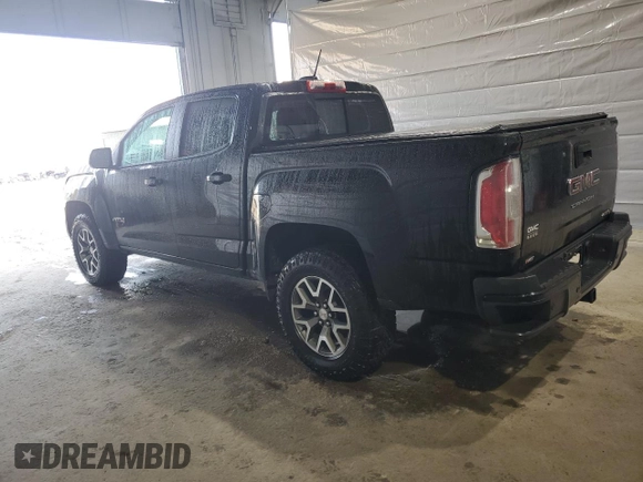 2021 GMC Canyon 4WD AT4 w/Leather with VIN 1GTG6FEN8M1255144, listed as a Copart auction lot 50186815 with 43,610 mi miles and Salvage Title. Bid and sale history available at carsss.com. Image 2.