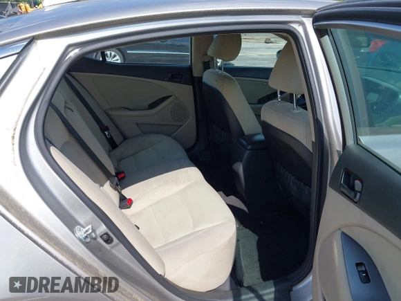 2015 Kia Optima LX with VIN 5XXGM4A79FG477619, listed as a IAAI auction lot 42561432 with 125,274 mi miles and . Bid and sale history available at DreamBid. Image 8.