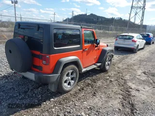 2015 Jeep Wrangler Sport with VIN 1C4AJWAG7FL582721, listed as a IAAI auction lot 41989505 with 102,961 mi miles. Bid and sale history available at carsss.com. Image 4.