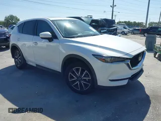 2018 Mazda CX-5 Grand Touring with VIN JM3KFADM2J1422512, listed as a IAAI auction lot 42010801 with 48,567 mi miles and . Bid and sale history available at DreamBid. Image 1.