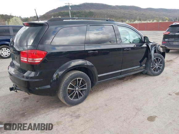 2018 Dodge Journey SE with VIN 3C4PDCAB1JT446005, listed as a IAAI auction lot 42001854 with 70,074 mi miles and . Bid and sale history available at DreamBid. Image 4.