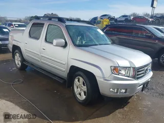 2014 Honda Ridgeline RTL with VIN 5FPYK1F51EB012843, listed as a IAAI auction lot 41629002 with 114,761 mi miles. Bid and sale history available at carsss.com. Image 1.