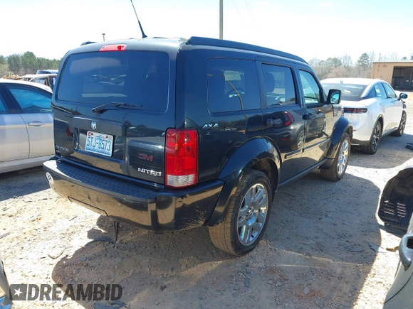 2011 Dodge Nitro Heat with VIN 1D4PU4GX7BW565927, listed as a IAAI auction lot 41803129 with 84,980 mi miles. Bid and sale history available at carsss.com. Image 4.