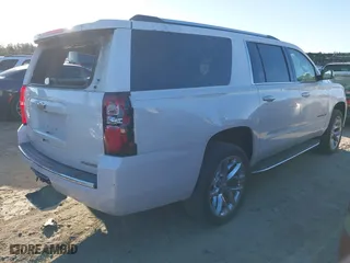 2019 Chevrolet Suburban Premier with VIN 1GNSCJKC0KR293658, listed as a IAAI auction lot 40563834 with 153,619 mi miles. Bid and sale history available at carsss.com. Image 4.