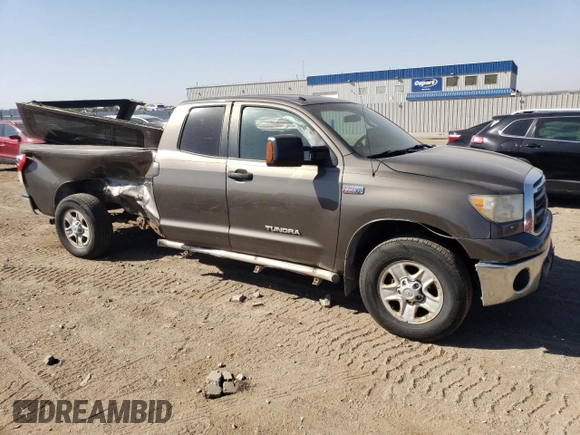 2010 Toyota Tundra 4WD Truck with VIN 5TFCY5F18AX009492, listed as a Copart auction lot 74092164 with 210,981 mi miles and Clean Title. Bid and sale history available at carsss.com. Image 4.