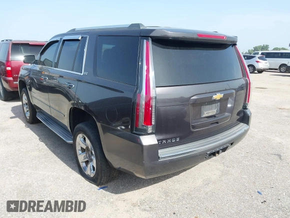 2015 Chevrolet Tahoe LTZ with VIN 1GNSCCKC2FR170090, listed as a IAAI auction lot 42616452 with 249,940 mi miles and . Bid and sale history available at DreamBid. Image 3.