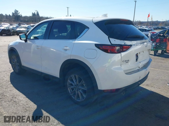 2021 Mazda CX-5 Grand Touring with VIN JM3KFBDM6M0483135, listed as a IAAI auction lot 41590430 with 33,466 mi miles. Bid and sale history available at carsss.com. Image 3.