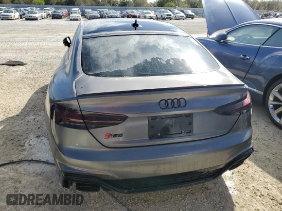 2022 Audi RS 5 Sportback z VIN WUAAWCF57NA901250, wystawiony jako Copart lot #77305584 z przebiegiem Nie podano mil oraz Nie do naprawy. Historia ofert i sprzedaży dostępna na DreamBid. Obrazek 6.