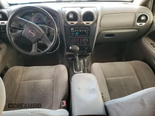 2005 GMC Envoy SLT with VIN 1GKDS13S652339845, listed as a Copart auction lot 77693684 with 220,306 mi miles and Salvage Title. Bid and sale history available at carsss.com. Image 8.