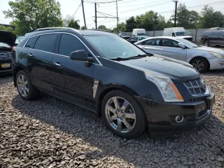2011 Cadillac SRX Premium Collection z VIN 3GYFNFEY9BS606335, wystawiony jako Copart lot #59009285 z przebiegiem 152 828 mil mil oraz Szkoda całkowita • Salvage title. Historia ofert i sprzedaży dostępna na DreamBid. Obrazek 4.