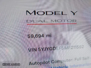 2021 Tesla Model Y Performance with VIN 5YJYGDEF5MF211592, listed as a IAAI auction lot 41766033 with 59,694 mi miles. Bid and sale history available at carsss.com. Image 16.