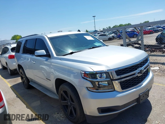 2015 Chevrolet Tahoe LT with VIN 1GNSCBKC9FR111001, listed as a IAAI auction lot 42440624 with 128,087 mi miles and . Bid and sale history available at DreamBid. Image 1.
