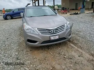 2013 Hyundai Azera z VIN KMHFH4JG4DA262993, wystawiony jako Copart lot #58497925 z przebiegiem 151 568 mil mil oraz Szkoda całkowita • Salvage title. Historia ofert i sprzedaży dostępna na DreamBid. Obrazek 13.