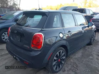 2016 MINI Cooper Hardtop 4 Door S with VIN WMWXU3C56G2B63682, listed as a IAAI auction lot 41244676 with 110,902 mi miles. Bid and sale history available at carsss.com. Image 4.
