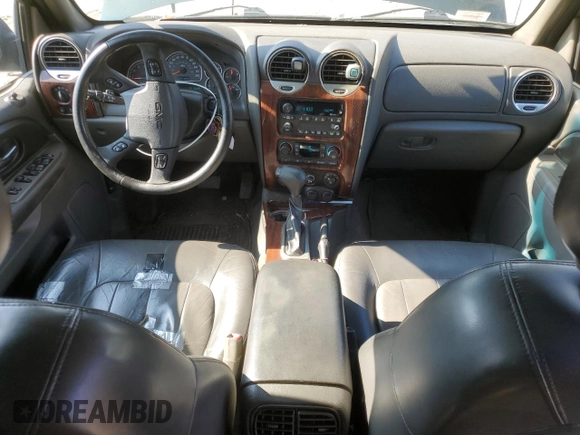 2003 GMC Envoy SLT with VIN 1GKDT13S032396374, listed as a Copart auction lot 74675134 with 115,280 mi miles and Salvage Title. Bid and sale history available at DreamBid. Image 8.