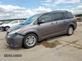 2015 Toyota Sienna XLE with VIN 5TDYK3DC4FS668957, listed as a Copart auction lot 63102645 with 135,049 mi miles and Salvage title. Bid and sale history available at DreamBid. Image 1.